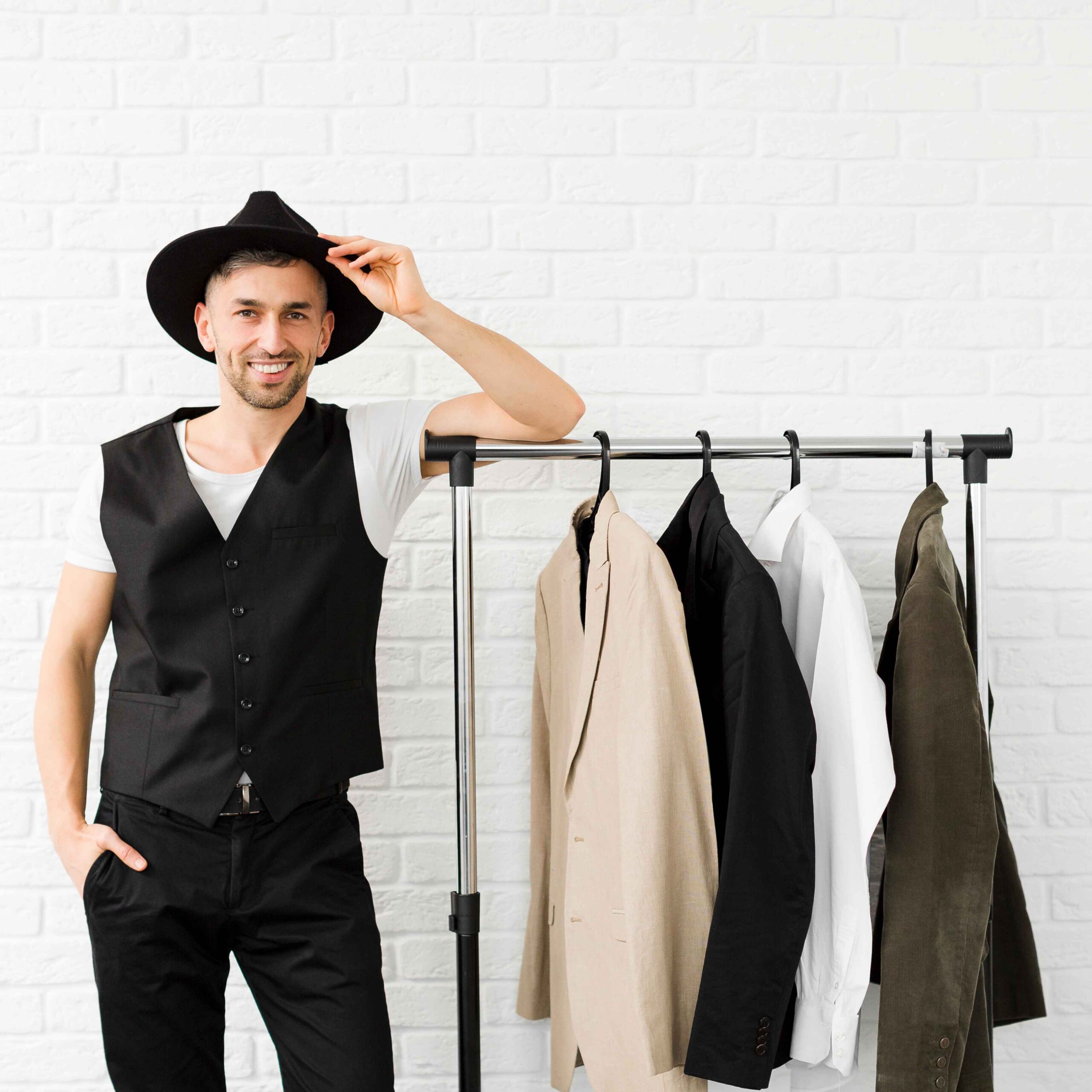 stylish-man-wearing-hat-standing-wardrobe (1)